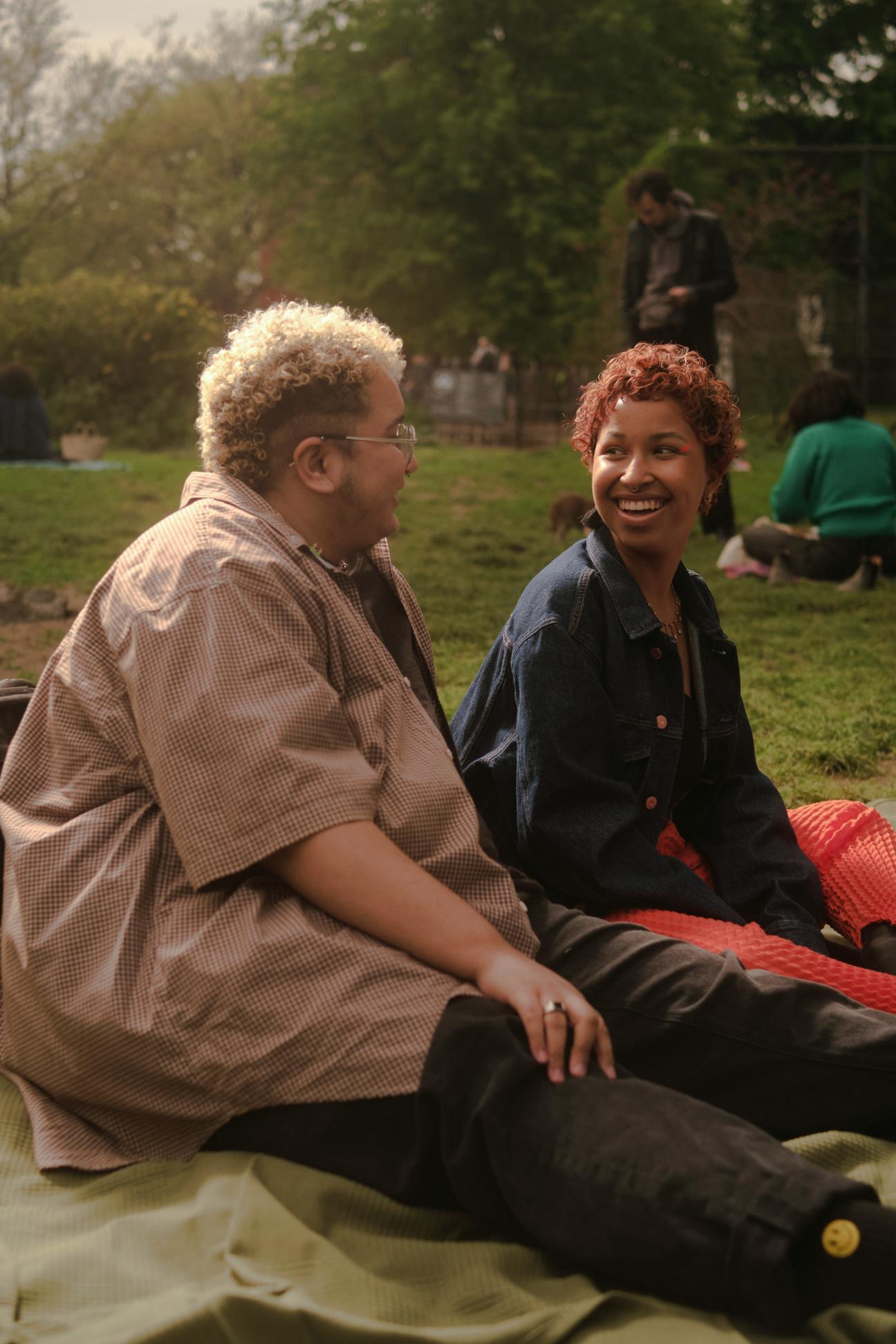 A trans couple at a picnic in the park