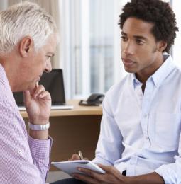Someone speaking to a professional for help