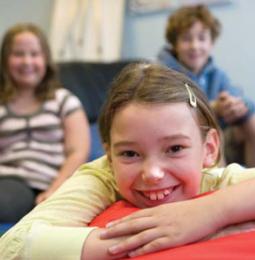 Girl smiling in a room