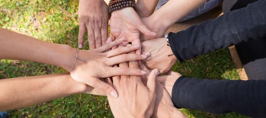 Hands coming together