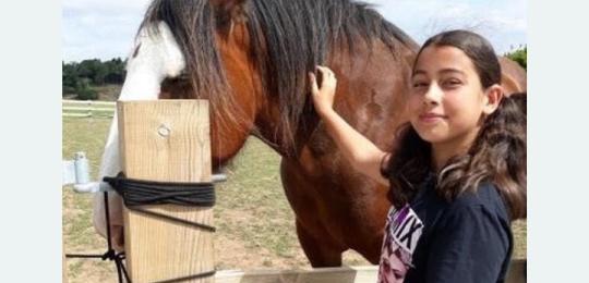 Photo of Lucy with a horse