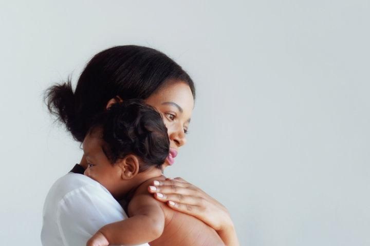 Photo of a mother holding her baby