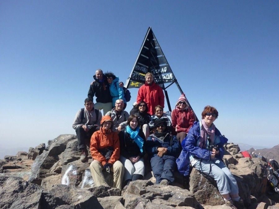 Trekker at the summit of Mount Toubkal