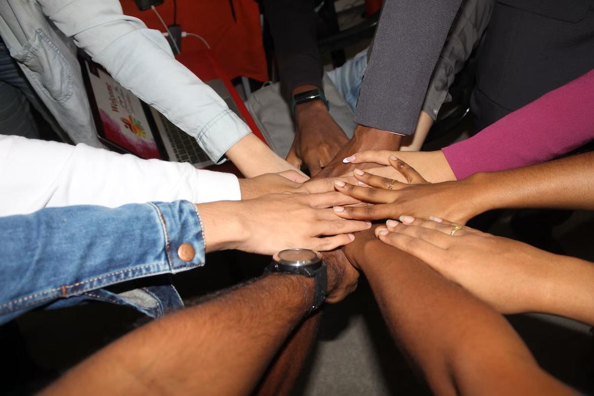 Hands coming together