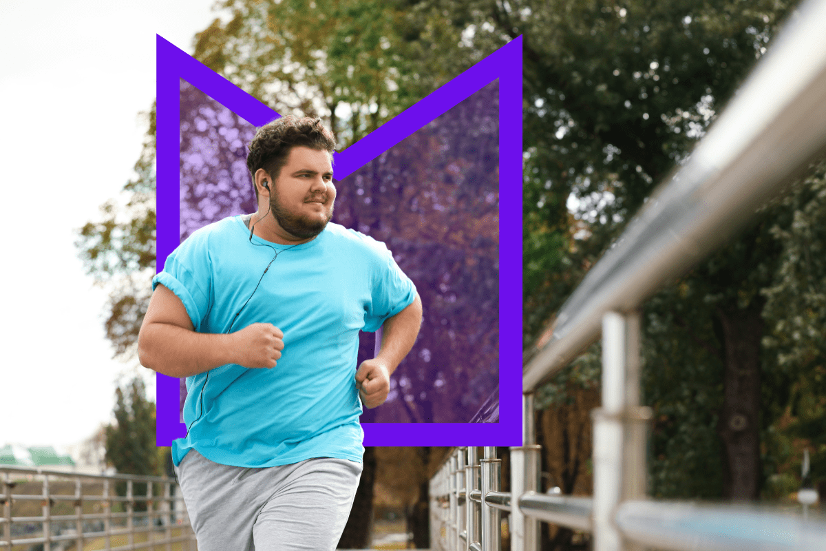 A young man running across a bridge while he listens to music